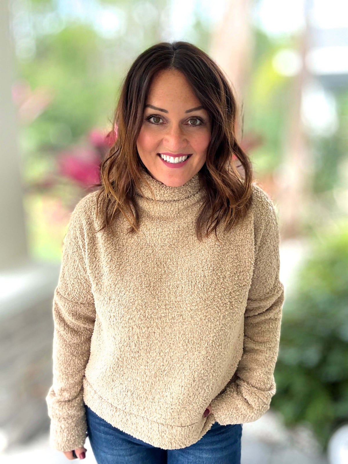 Woman wearing a beige Feeling Fuzzy Cozy Pullover with a warm and stylish look.