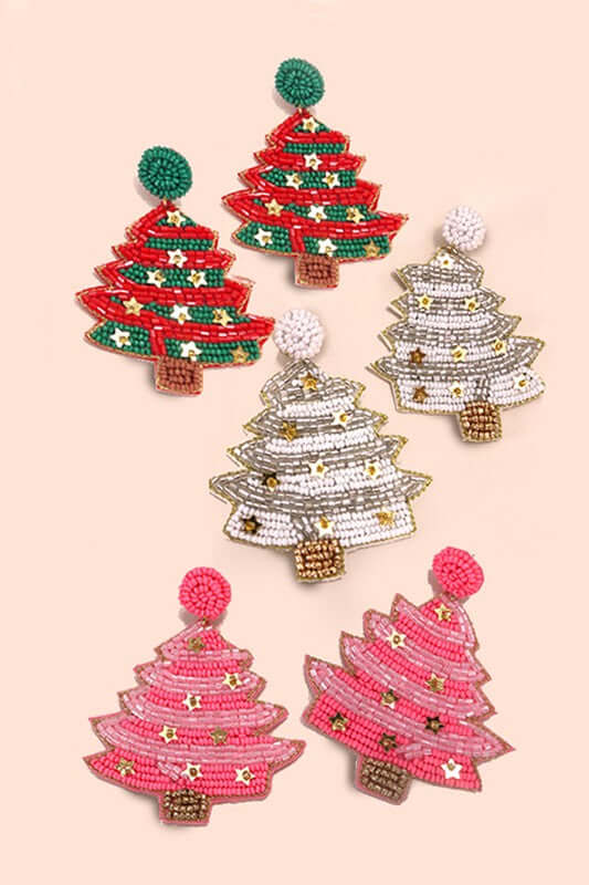 Beaded Christmas tree earrings in red, white, and pink designs with festive star accents on a neutral background.