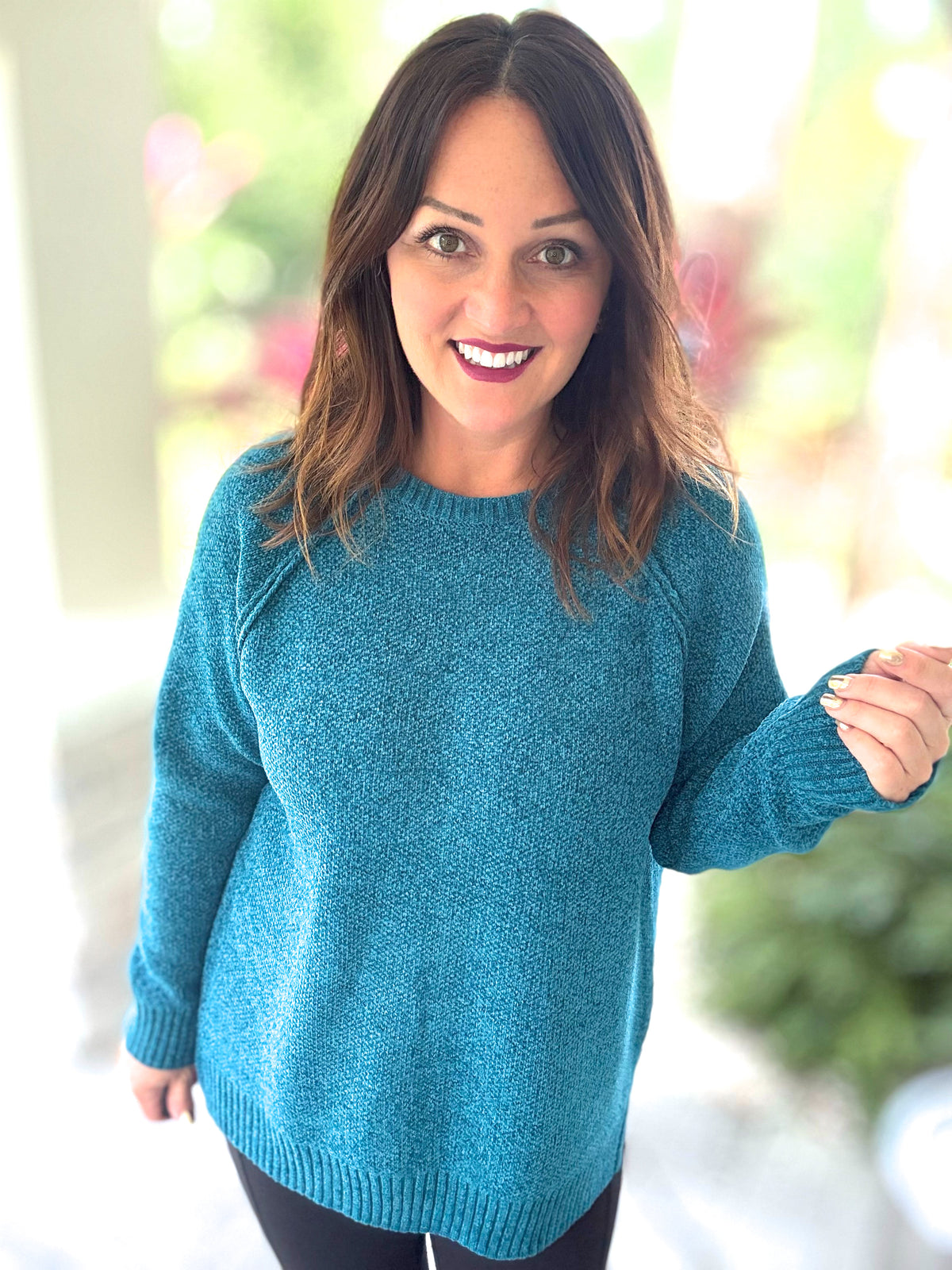 Woman wearing blue Chenille Dream Sweater with raglan design and round neck, showcasing cozy and chic boutique style.